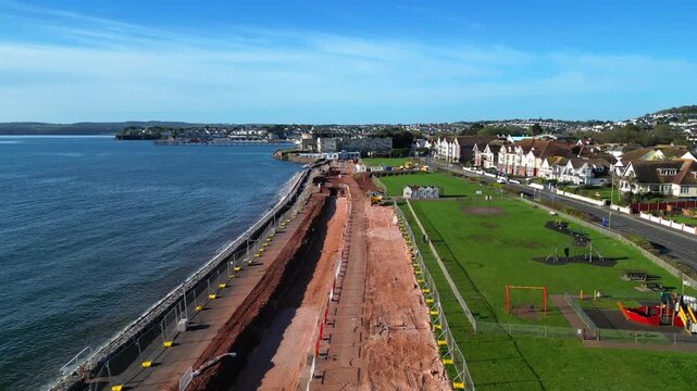 Paignton, Devon, England: DRONE VIEWS: A sea defence wall under construction on Preston Sands Green. The project will be completed in 2027 to protect seafront properties from global rising sea levels.