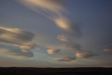 Fototapeta premium Lenticular clouds form across NOrthumberland, UK