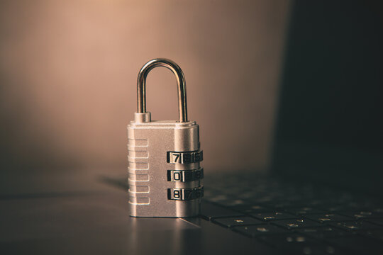 padlock and laptop keyboard with data protection symbol. cyber security concept