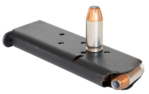 Loaded pistol magazine and single hollow poiint cartridge on top