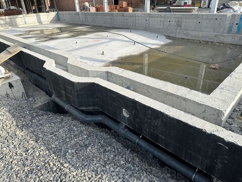 Construction site with unfinished swimming pool outdoors, closeup