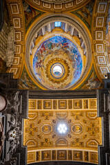 Fototapeta premium The ceiling of St. Peter's Basilica, a masterpiece of renaissance architecture, in the Vatican is shown