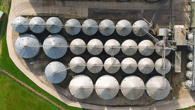 Aerial view of the grain storage silos and water treatment plant with industrial infrastructure and conveyor belts in Hemswell Cliff, England, United Kingdom.