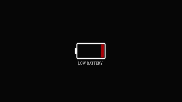 Animation featuring a low battery text icon against a black background, ideal for digital and tech-themed projects. Low battery animation.