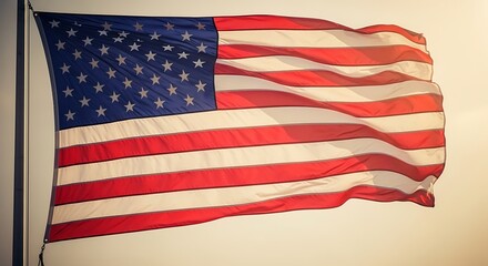 Obraz premium American flag waving in wind with dramatic lighting and patriotic texture