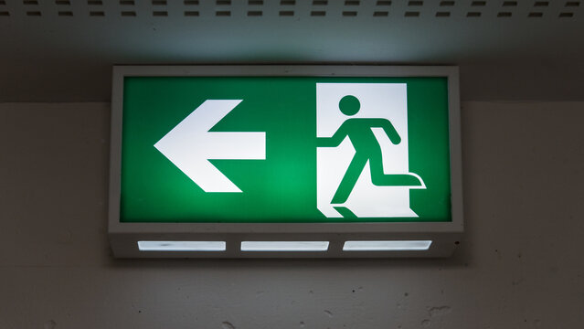 Emergency exit sign with arrow pointing left