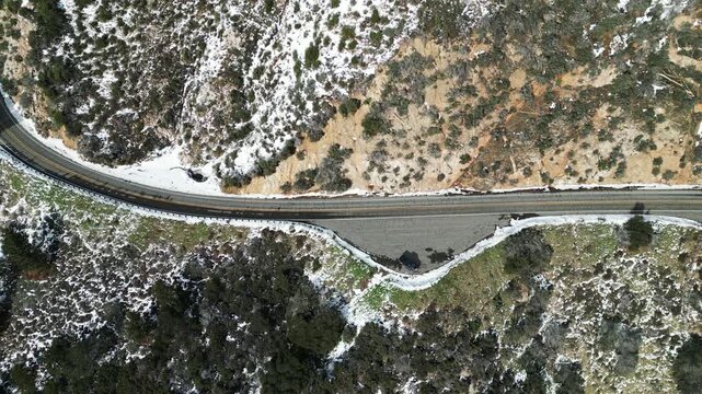 The California San Gorgonio San Bernardino Mountain Range near Mill Creek and Forest Fall in the Valley of the Falls looking at the Mountains and trees covered in Snow after a Winter Storm from a UAV 