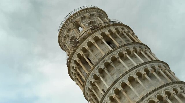 Leaning tower of pisa. Majestic leaning tower of pisa rotates, showcasing its intricate architecture and iconic tilt against a backdrop of cloudy sky, this historical landmark