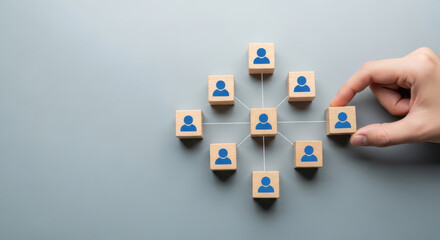 Fototapeta premium Organizational network structure with connected people icons on wooden blocks, showing team collaboration, stakeholder mapping, social graph, and business communication on a light background 