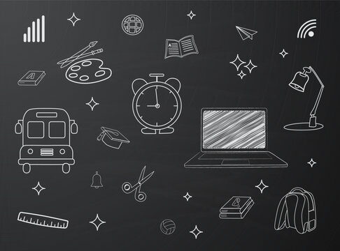 White educational chalk doodles with laptop and alarm-clock hand drawn on blackboard