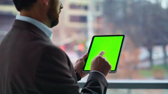 Executive using chroma key tablet in office closeup. Employee navigating mockup