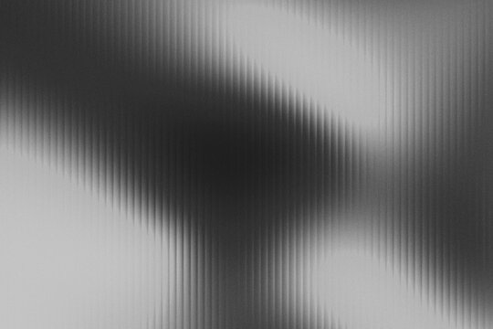 Abstract Black And White Vertical Motion Blur Wave Background With Dark Center Shadow And Smooth Grain Texture