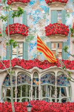 Casa Batllo Facade with Red Roses and Catalan Flag for Sant Jordi Day