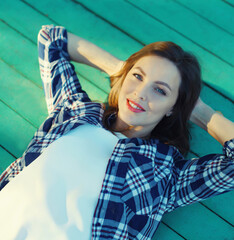 Fototapeta premium Beautiful happy young woman relaxing on a summer day