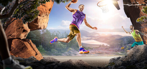 Basketball. Two basketball players practice on a basketball court in the wilderness. A beautiful landscape is in the background. © 103tnn