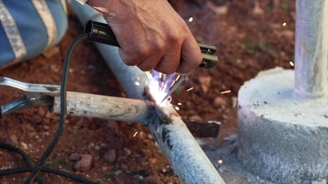 Welding process with bright sparks and smoke