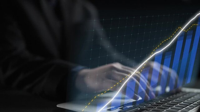 A business professional analyzes financial data on a laptop, highlighting growth trends through dynamic graphs and charts in a modern office setting. Copula