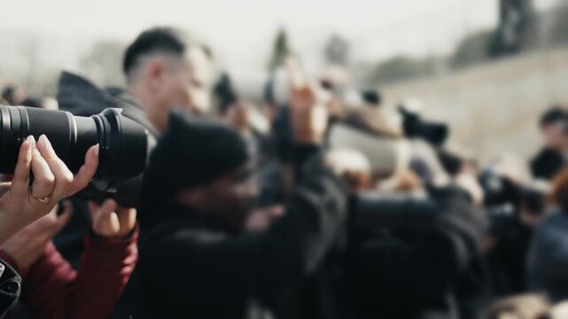 Group of photographers and paparazzi working on red carpet