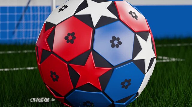 Transitioning camera pulling rotating multicolored soccer ball into close-up over turf showing net
