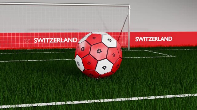 Spinning red-white soccer ball dropping, bouncing into goal mouth on grass pitch, coming to rest