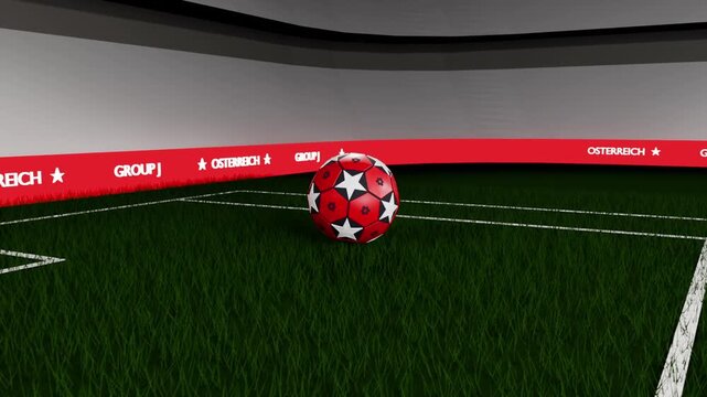 Dropping down, red soccer ball rotating, landing, settling on turf near goal ribbon for branding