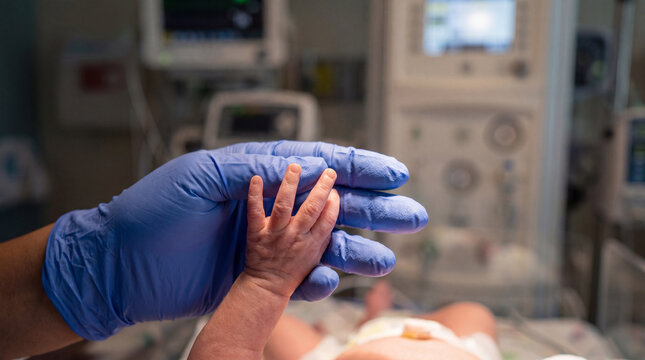 International Nurses Day healthcare nurse newborn baby hands touching care compassion neonatal medical connection promotional editorial content