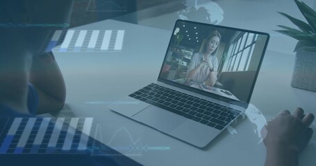 Watching local viewer in blue shirt leaning at home desk, viewing laptop with plant and overlays © vectorfusionart