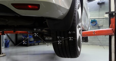 Fototapeta premium Showing white car revealing rear-right wheel, spring at garage with orange lift-arms, AR overlay