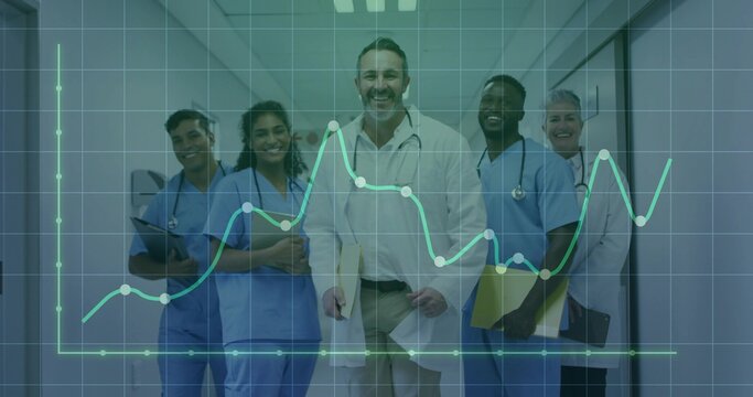 Standing lead doctor wearing white shirt and stethoscope with blue scrubs in corridor, data overlay