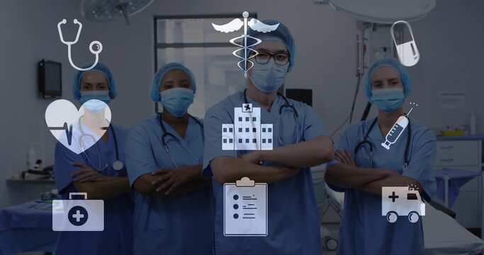 Standing medical team in blue scrubs crossing arms in operating room, with masks and icons