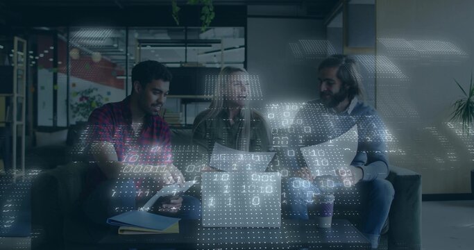 Discussing project details three team members reviewing laptop and docs in office with data overlay