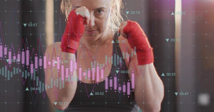 Holding guard boxer training at gym, wearing dark tank top and red hand wraps, chart overlay