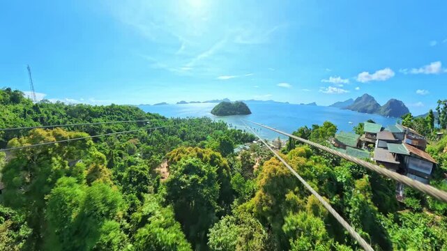 Tourists experiencing an exhilarating zipline adventure high above the lush green landscape of Las Cabanas Beach and the sparkling blue waters of Bacuit Bay in El Nido, Palawan island of Philippines