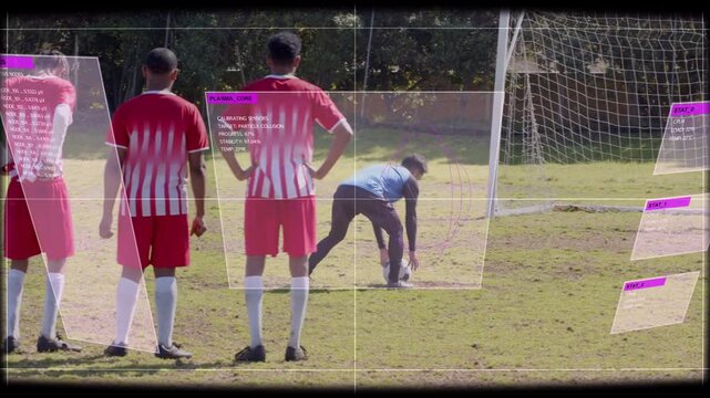 Kicker placing ball, wall holding position, keeper moving, HUD overlaying soccer pitch to shoot