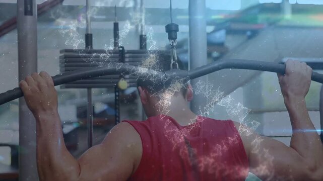 Man gripping gym lat pulldown bar and doing behind-neck reps causing spark overlay showing lat work