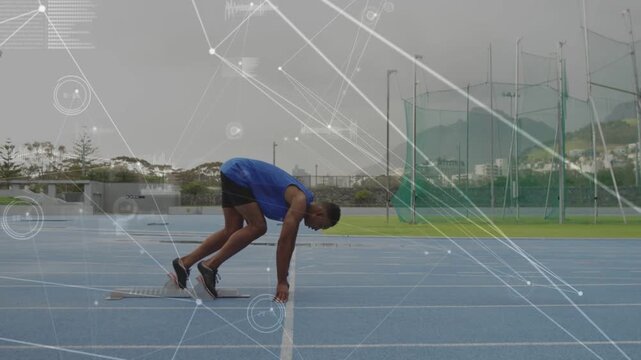 Male sprinter pushing from blocks, accelerating on blue sports track with HUD overlays over runner