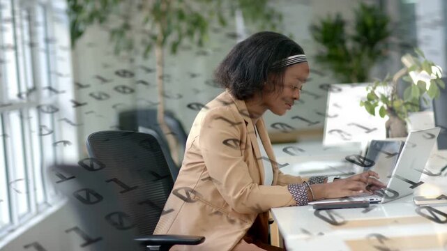 Woman starting typing on laptop in business, editing while code stream drifting across screen