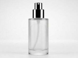 Fototapeta premium A clear glass perfume bottle with a silver cap stands alone on a white surface in a studio setting.