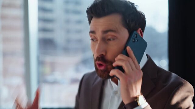 Emotional boss scolding mobile phone displeased work closeup. Angry businessman