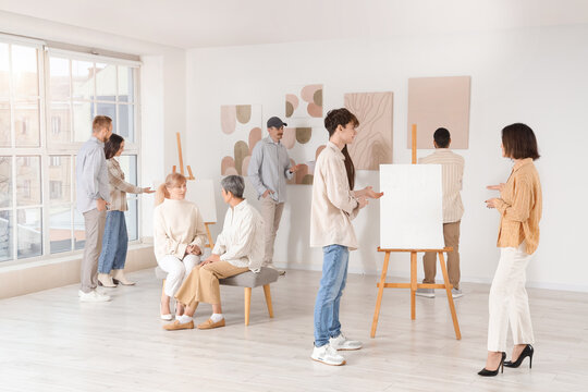 Group of people at art gallery exhibition