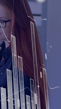 Vertical video: Analyst scanning screen while data updating charts revealing face tracking market