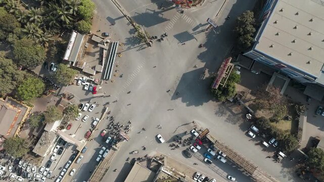 Busy Urban Road Intersection Aerial View, Drone View of City Traffic Junction, Overhead View of Urban Street Network, Aerial City Crossroad with Vehicles stock video.