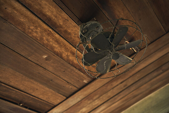 vintage ceiling fan on rustic wooden ceiling