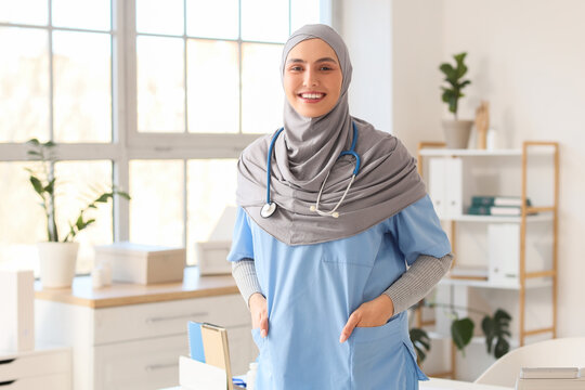 Female Muslim doctor in hijab with stethoscope at hospital