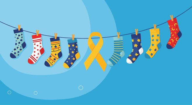 Row of colorful patterned socks hanging on a clothesline with a yellow awareness ribbon for Down Syndrome awareness day.