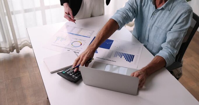 Analyze financial data and accounting record with calculator in meeting office, Accounting company charts and graphs banner, double exposure successful business finance and taxation planning concept.