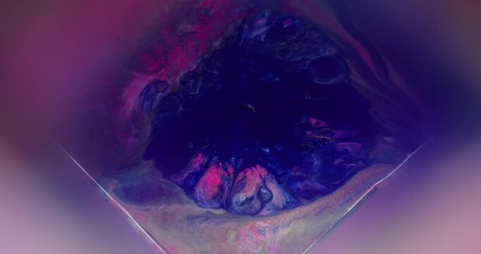 Cube splatter. Splash art. Defocused blue pink purple colorful ink shiny texture flow droplet spreading on abstract creative background.