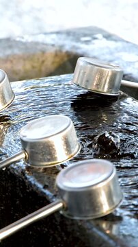 Traditional Japanese Temizuya Water Purification Fountain at Oyama Shrine in Kanazawa