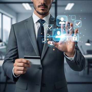 Businessman holding credit card and interacting with holographic user icons for customer management.