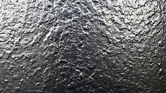 Reflective industrial rough gray metallic surface with gritty silver steel plate texture abstract dark brushed iron wall backdrop for architectural design and construction backgrounds